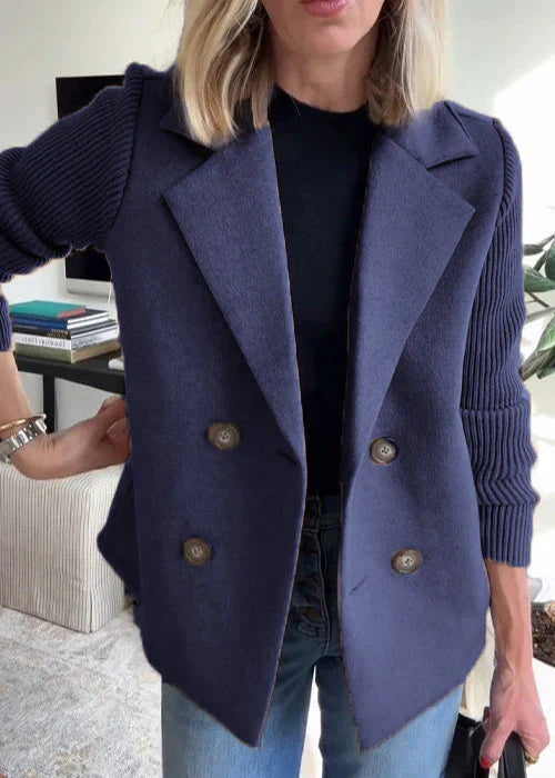 Les Odettes Lumière™ elegant tailored coat, front view showing sleek design, lapels, and tailored fit in soft fabric.