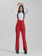 Les Odettes Gsou Snow Women's multi-color stretch fabric ski bibs, showing the vibrant, fitted snowboard and ski pants design.