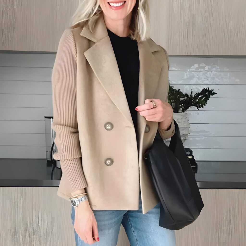 Les Odettes Lumière™ elegant tailored coat jacket with structured fit and classic design visible in the image.
