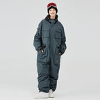 Women's Arctic Queen IceStorm mountain adventure one-piece snowsuit by Les Odettes, featuring insulated winter gear for cold weather.