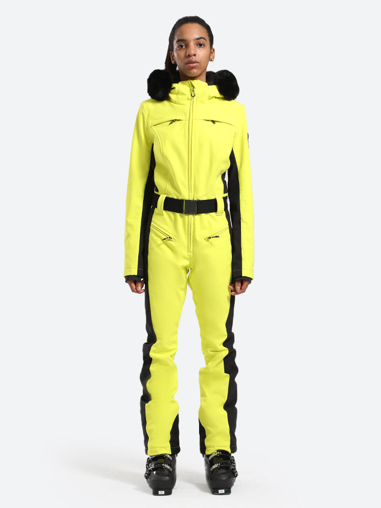 Les Odettes women's classic faux fur one-piece ski suit with hood, front zipper, and ski pockets, perfect for winter sports.
