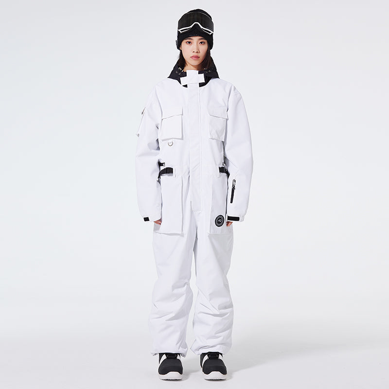 Women's Arctic Queen IceStorm mountain adventure one-piece snowsuit by Les Odettes, featuring insulated design and winter gear details.