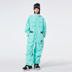 Les Odettes Women's Arctic Queen IceStorm mountain adventure one-piece snowsuit, insulated winter outerwear with hood and snow-resistant fabric.