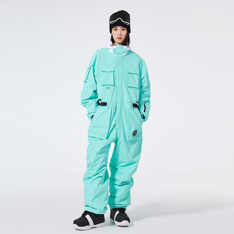 Les Odettes Women's Arctic Queen IceStorm mountain adventure one-piece snowsuit, insulated winter outerwear with hood and snow-resistant fabric.