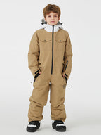 Kids' unisex Mountain Explorer waterproof one-piece snow suit by Les Odettes, featuring a vibrant winter design and insulated material.