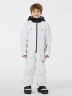 Kids' unisex mountain explorer waterproof one-piece snow suit by Les Odettes, featuring bright colors and winter snow-resistant fabric.