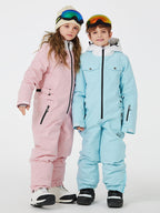 Kids' unisex mountain explorer waterproof one-piece snow suit by Les Odettes, showing the bright blue winter snow suit with hood.