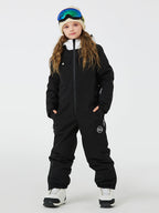 Kids' unisex mountain explorer waterproof one-piece snow suit by Les Odettes, featuring a cozy, insulated design for winter outdoor activities.