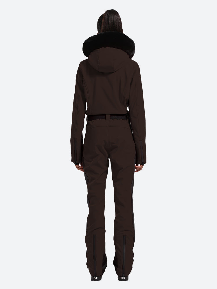 Les Odettes women's classic faux fur one-piece ski suit with hood, front zipper, and insulated design for winter skiing.