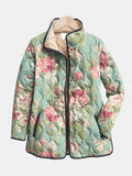 Les Odettes Evie™ retro quilted jacket in pastel pink with a classic quilted pattern and collar, displayed on a hanger.