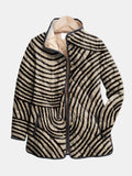 Fern™ Retro Circle Design Quilted Jacket by Les Odettes featuring a quilted fabric with bold circular patterns and a classic silhouette.