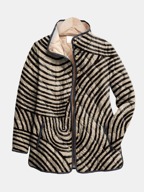 Fern™ Retro Circle Design Quilted Jacket by Les Odettes featuring a quilted fabric with bold circular patterns and a classic silhouette.