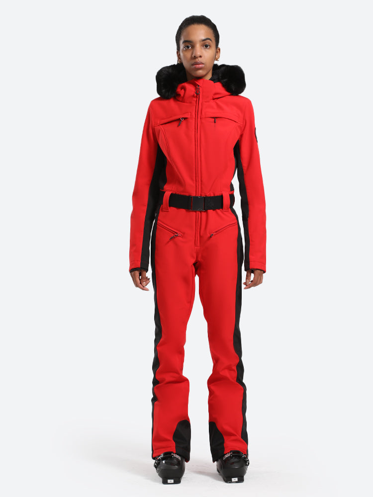 Les Odettes women's classic faux fur one-piece ski suit with hood, designed for winter skiing and outdoor snow activities.