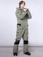 Men's RAWRWAR highland cargo one-piece snowsuit by Les Odettes, featuring insulated snow protection and rugged outdoor design.