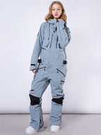 Men's Les Odettes RAWRWAR high land cargo snowsuit in one-piece with insulated design and cargo pockets, suitable for winter outdoor activities.