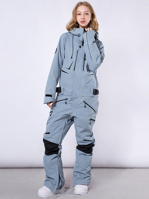 Men's Les Odettes RAWRWAR high land cargo snowsuit in one-piece with insulated design and cargo pockets, suitable for winter outdoor activities.