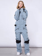 Men's RAWRWAR highland cargo one-piece snowsuit by Les Odettes, featuring durable fabric and functional cargo pockets.