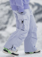 Men's Rabbit Snow UrbanRush Prime Cargo Baggy Snow Pants by Les Odettes, showing the relaxed fit and snow-resistant fabric.