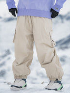 Men's Rabbit Snow StreetFlow Freestyle Cargo Baggy Snow Pants by Les Odettes, showing their loose fit, rugged fabric, and winter-ready design.