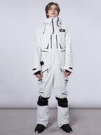 Men's RAWRWAR high land cargo one-piece snowsuit by Les Odettes, featuring a insulated winter suit with cargo pockets and a hood.
