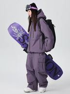 Les Odettes women's Searipe durable mountain snow suit with waterproof fabric, insulated design, and adjustable features for winter snowboarding.
