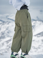 Men's Rabbit Snow StreetFlow Freestyle Cargo Baggy Snow Pants by Les Odettes, showing the black, insulated winter snow pants with cargo pockets.