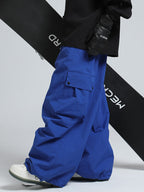 Men's Gsou Snow Mountain Chill freestyle baggy snowboard pants by Les Odettes, showing the relaxed fit and waterproof fabric.