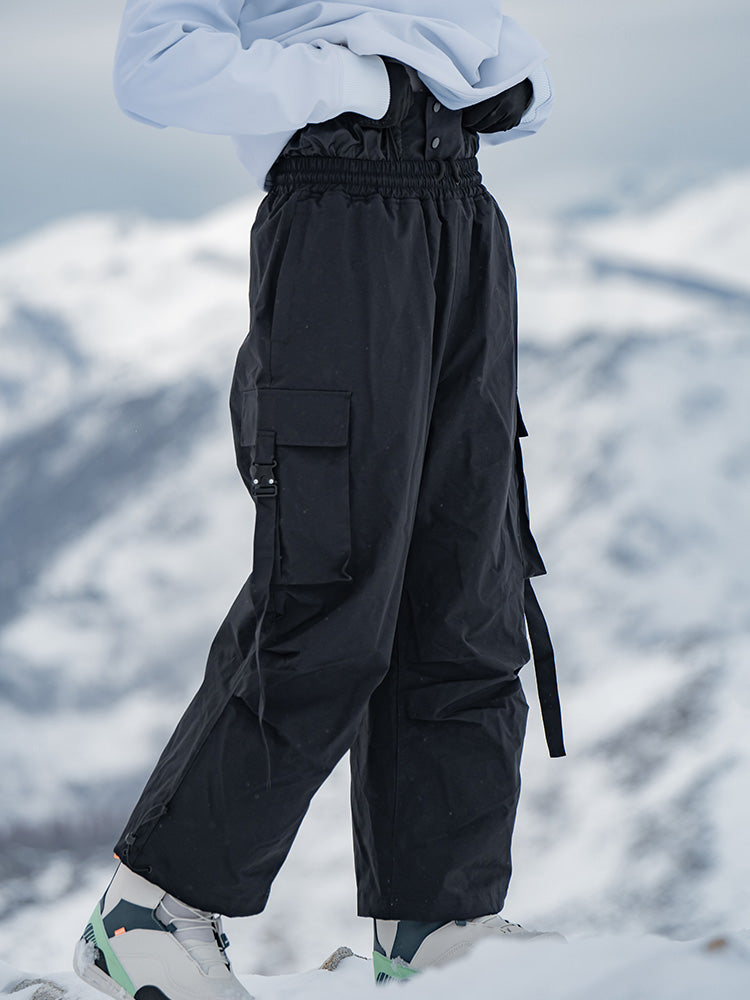 Men's Rabbit Snow UrbanRush Prime cargo baggy snow pants by Les Odettes, showing the dark, insulated winter pants with multiple pockets.