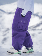 Men's Rabbit Snow StreetFlow Freestyle Cargo Baggy Snow Pants by Les Odettes, showing the relaxed fit and cargo pockets in snowy outdoor setting.