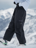 Men's Rabbit Snow UrbanRush Prime Cargo Baggy Snow Pants by Les Odettes, showing the black winter snow pants with multiple cargo pockets.
