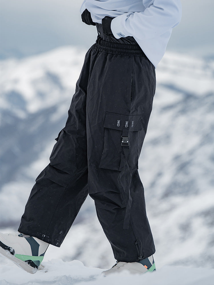 Men's Rabbit Snow UrbanRush Prime Cargo Baggy Snow Pants by Les Odettes, showing the black winter snow pants with multiple cargo pockets.