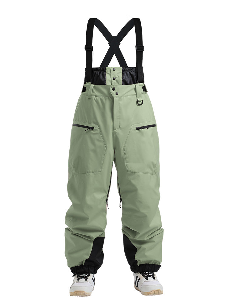 Womens snow pants by Les Odettes, durable mountain cargo snow bibs with all-weather functionality and adjustable straps.