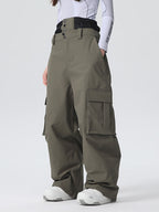 Women's Les Odettes snow pants with a baggy fit, durable mountain design, and all-function features for winter snow activities.