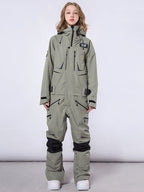 Men's RAWRWAR high land cargo one-piece snowsuit by Les Odettes, featuring durable fabric and cargo pockets, suited for winter outdoor activities.