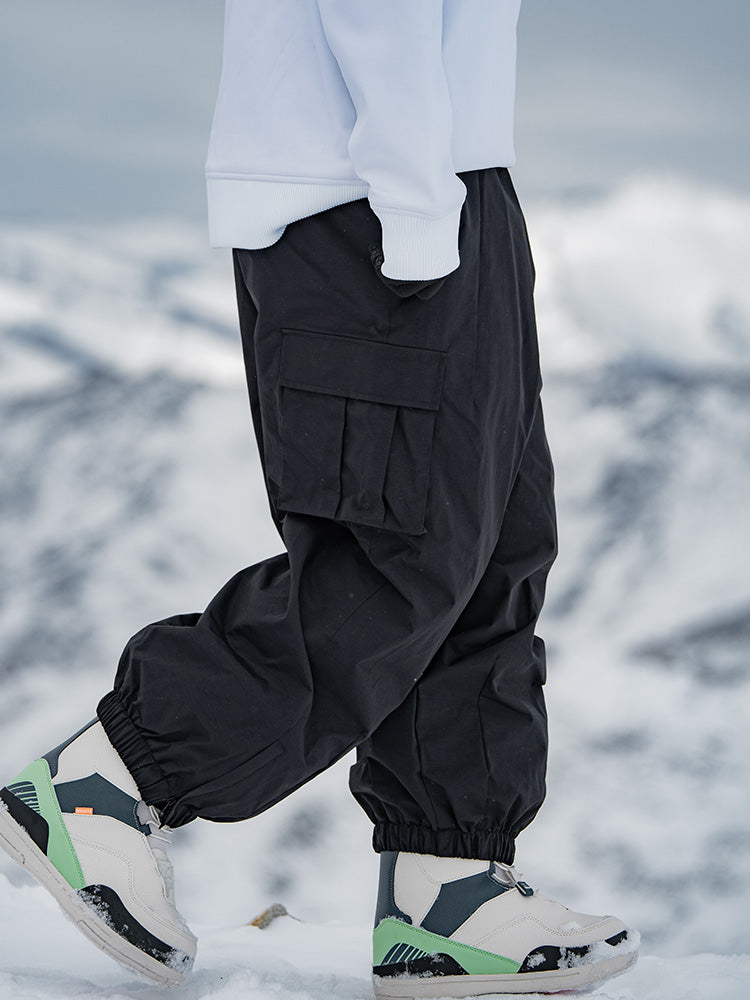 Men's Rabbit Snow StreetFlow Freestyle Cargo Baggy Snow Pants by Les Odettes, showing their relaxed fit and snow-resistant fabric.