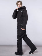 Men's RAWRWAR high land cargo one-piece snowsuit by Les Odettes, shown in a durable winter snowsuit with cargo pockets.