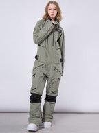 Men's Les Odettes RAWRWAR highland cargo one-piece snowsuit with durable fabric and multiple cargo pockets, suitable for winter outdoor activities.
