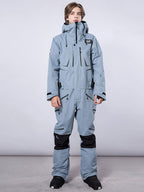 Men's RAWRWAR high land cargo one-piece snowsuit by Les Odettes, featuring a rugged snowproof design and cargo pockets.