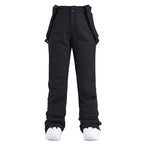 Women's insulated snow pants by Les Odettes, winter ski bibs with warm, waterproof material, suitable for snowy mountain adventures.
