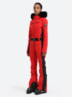 Les Odettes women's classic faux fur one-piece ski suit, stylish ski attire with cozy fur collar and insulated design for winter skiing.