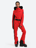 Les Odettes women's classic faux fur one-piece ski suit with hood and zipper, designed for winter outdoor skiing.
