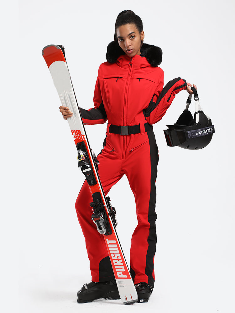 Women's Les Odettes classic faux fur one-piece ski suit with a hood, front zipper, and insulated design for winter snow skiing.