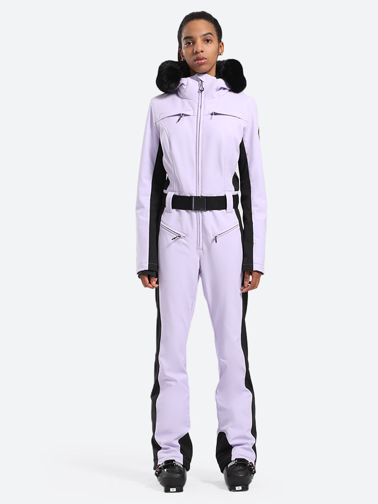 Les Odettes women's classic faux fur one-piece ski suit with a hood, designed for warmth and style on the slopes.