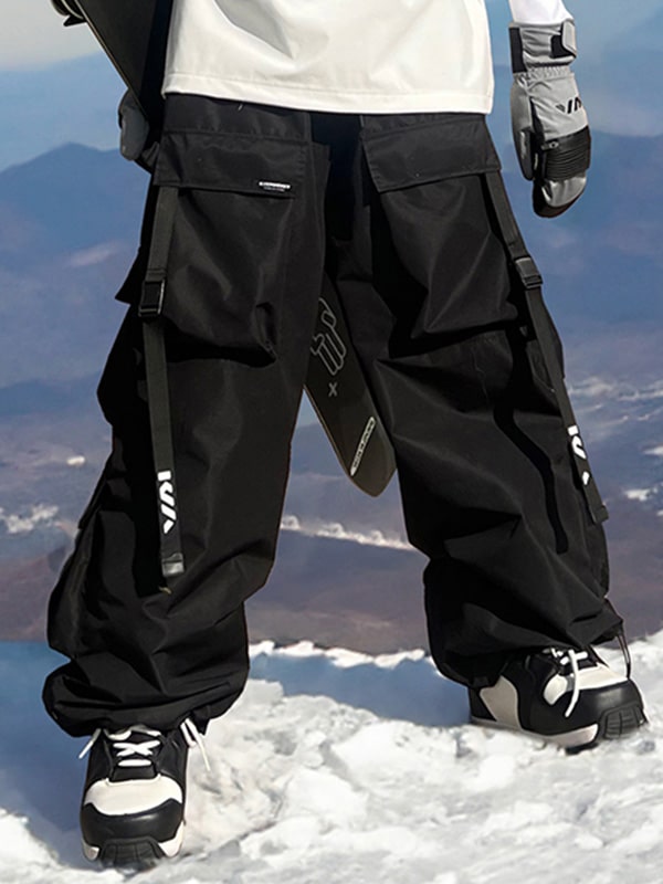 Men's Les Odettes snow pants with a relaxed fit, mountain-inspired design, and adjustable waist for winter snowboarding or skiing.