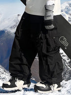 Men's Les Odettes snow pants with baggy fit and mountain chill design, suitable for cold weather and winter outdoor activities.