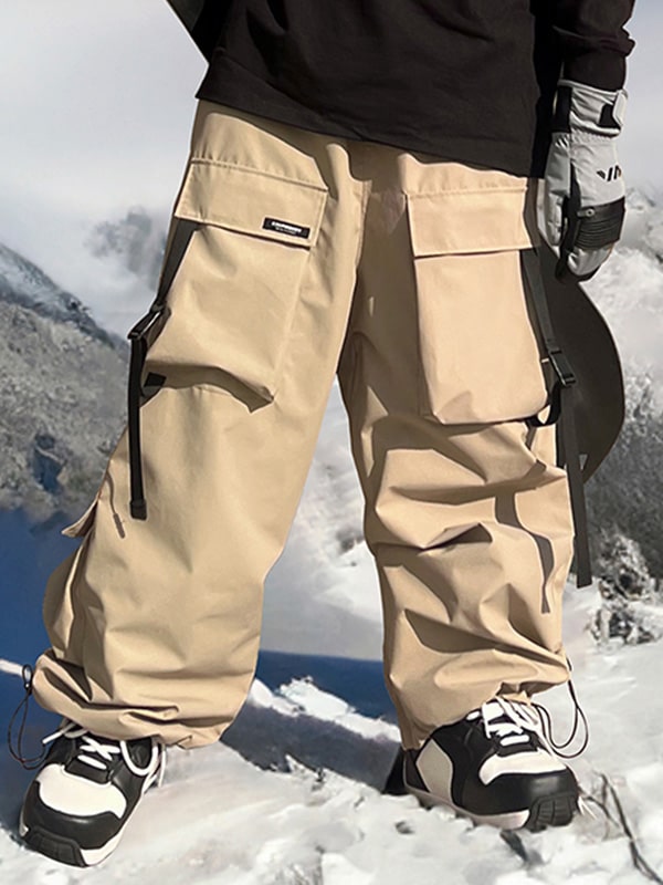 Les Odettes men's snow pants with a baggy fit, mountain chill design, black color, and adjustable waistband for winter snowboarding.