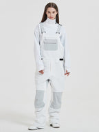 Women's Les Odettes snowboarding bibs with rabbit pattern, insulated snow pants for mountain skiing and freestyle snowboarding.