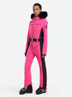 Les Odettes women's classic faux fur one-piece ski suit with hood, designed for warmth and style on the slopes.