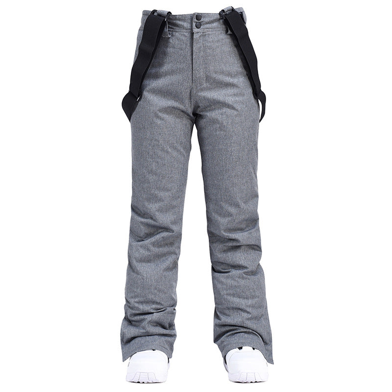 Women's insulated snow pants by Les Odettes with mountain and Aurora winter snow pattern, designed for skiing and cold weather outdoor wear.