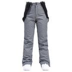 Women's insulated snow pants by Les Odettes with mountain and Aurora winter snow pattern, designed for skiing and cold weather outdoor wear.